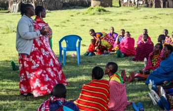 GCF Executive Director and women during a training session.